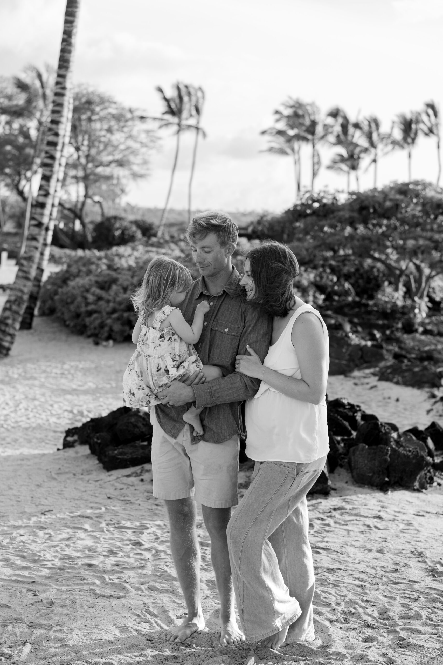 Wedding photographer with her family during pregnancy, announcing a move to Northern Michigan and continued service in Michigan and North Carolina