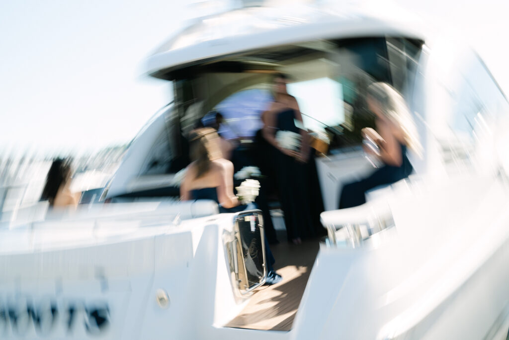 Bridal Party Boat Ride on Lake Michigan at Bay Harbor Bride, groom, and bridal party enjoying a boat ride on Lake Michigan after their wedding ceremony at Bay Harbor